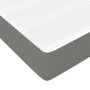 Dunkelgraues Boxspringbett 140x190 cm mit weißer Matratze und Topper. Stoffbezug.
