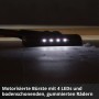 Motorisierte Bodendüse des Einhell Akku-Stielstaubsaugers mit 4 LEDs beleuchtet Staub auf dunklem Boden für gründliche Reinigung.