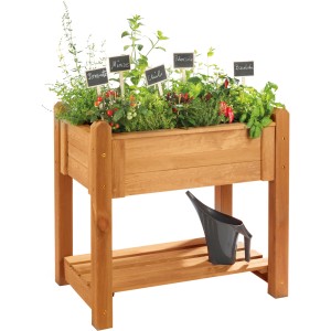 Orangefarbenes Wilk Kräuter-Hochbeet Basic aus Holz mit Kräutern und Ablage.