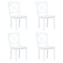 Essgruppe: Vier weiße Holzstühle mit X-förmiger Rückenlehne.