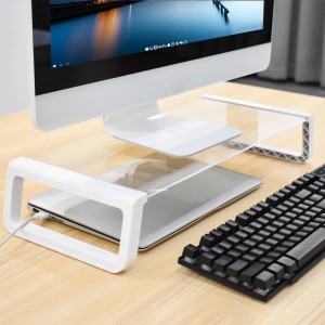 Svita Ansan Monitorerhöhung in Weiß mit Glasplatte, unter der ein Laptop steht.