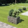 furnicato Gabionen-Hochbeet aus verzinktem Stahl, gefüllt mit Steinen, im Garten.