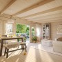 Innenansicht: Palmako Gartenhaus Lisa, grau-weiß lackiert, mit Möbeln und viel Licht.