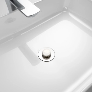 Weißer Sanilo Pop Up Waschbeckenstöpsel im modernen Waschbecken mit Armatur.