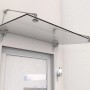Modernes Vordach aus Echtglas und Edelstahl (140x90x40cm) schützt den Eingangsbereich.