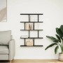 Schwarzes vidaXL Würfelregal mit 12 Fächern aus Holzwerkstoff an weißer Wand.