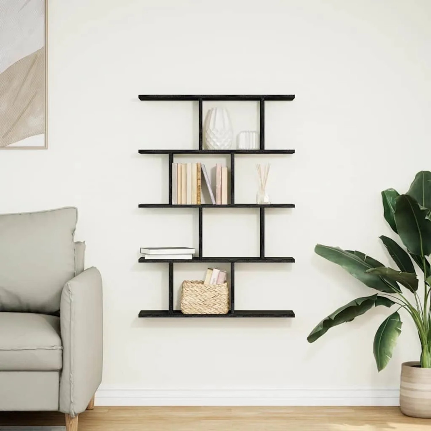 Schwarzes vidaXL Würfelregal mit 12 Fächern aus Holzwerkstoff an weißer Wand.