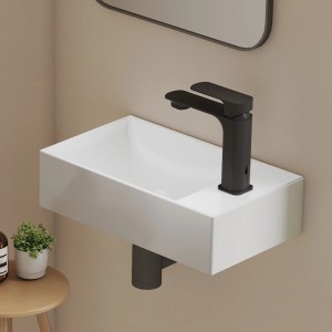 Weißes Emke Keramik Wandwaschbecken 38x22 cm mit schwarzer Armatur im modernen Bad. Kompakt für Gäste-WC.