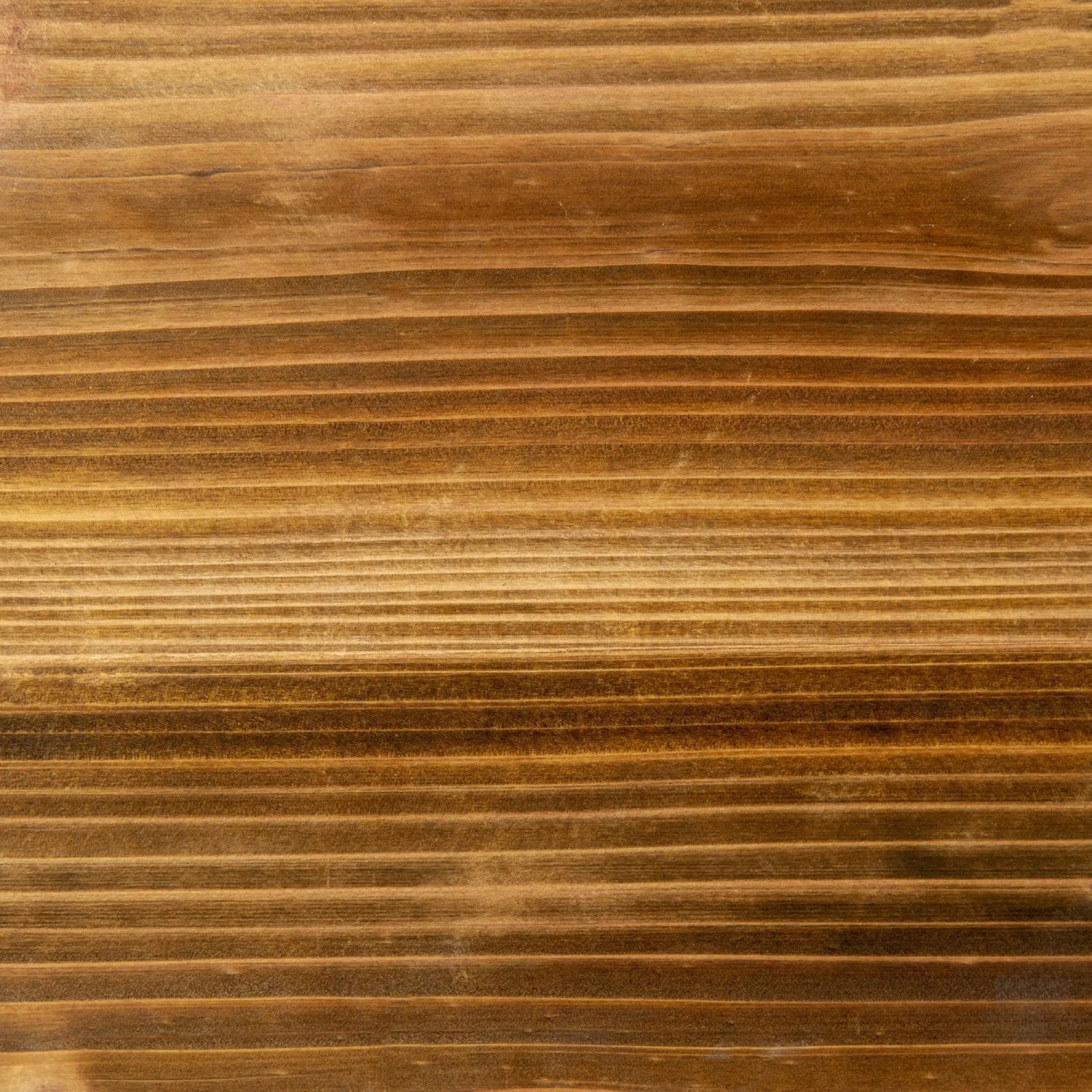 Detailaufnahme von verkohltem Tannenholz für Outsunny Hochbeet. Holzmaserung sichtbar.