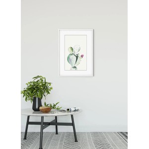 Komar Wandbild Prickly Pear (50x70 cm) mit Kaktusmotiv im weißen Rahmen.