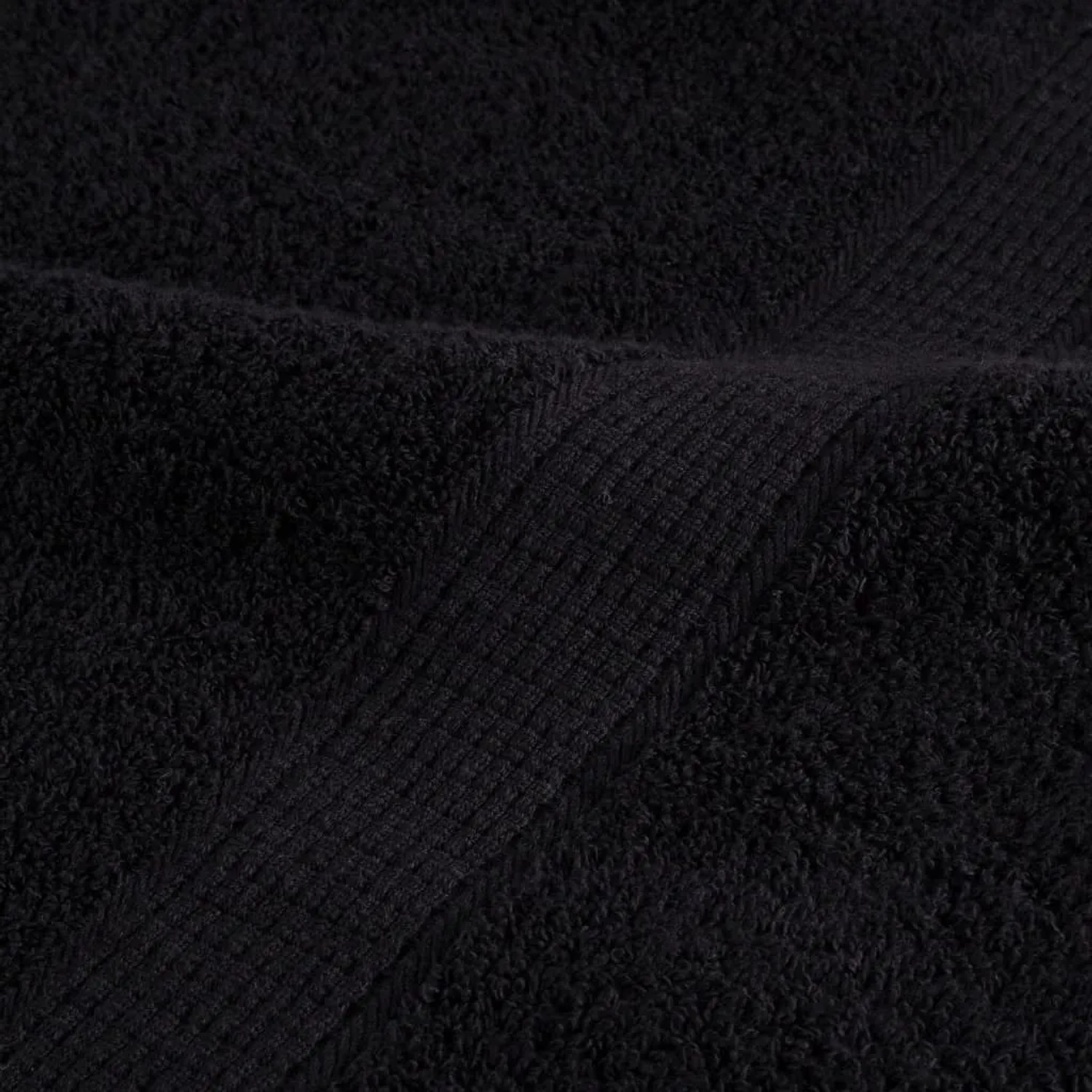 Detailaufnahme: Schwarzes Premium-Badetuch aus Baumwolle (100x150 cm).