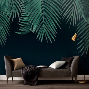 Art for the Home Fototapete Yuna mit grünen Blättern auf blauem Grund, passend zu modernem Sofa.