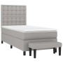 Hellgraues Boxspringbett 90x200 cm mit Matratze und Bank.