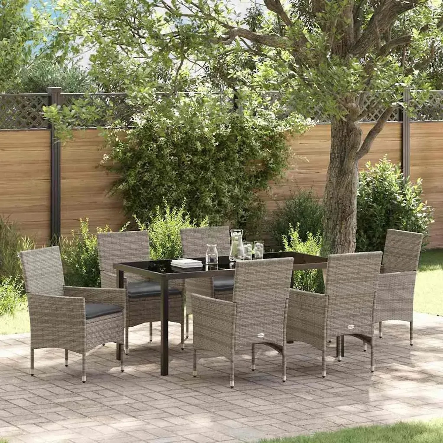 Graue 7-teilige vidaXL Garten Essgruppe aus Polyrattan mit Tisch und Stühlen mit Kissen.