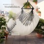 Beiger Tectake Hängesessel Malika mit Kissen, Bücherfach und Getränkehalter auf Balkon.
