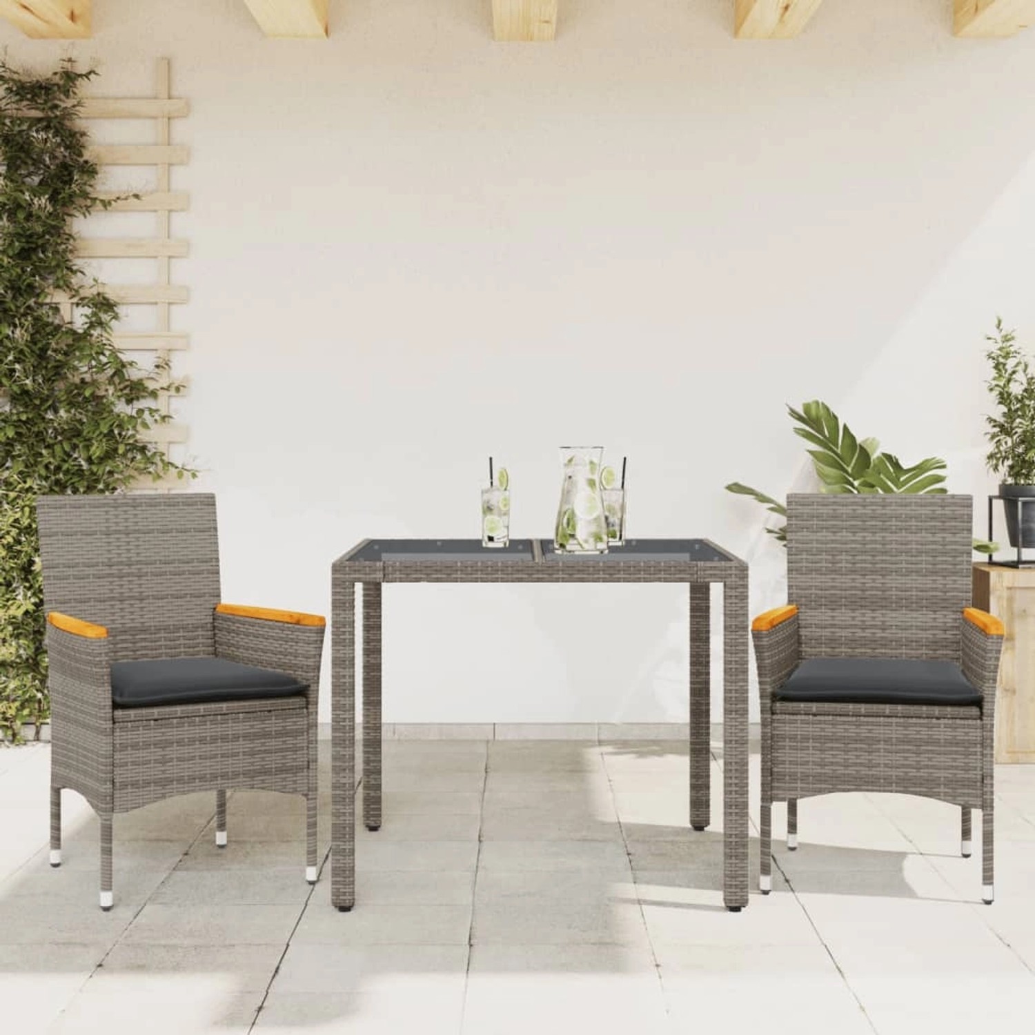 3-teilige Garten Essgruppe vidaXL aus grauem Rattan mit Tisch und Stühlen inklusive Kissen.