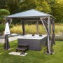 Home Deluxe Outdoor Whirlpool White Marble Plus mit Treppe und Thermoabdeckung im Garten.