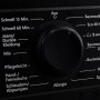 Detailaufnahme: Programmwahlknopf der schwarzen Telefunken Waschmaschine mit verschiedenen Waschprogrammen.
