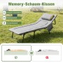 Graues Sekey Klapp-Campingbett mit verstellbarer Rückenlehne und Memory-Schaum-Kissen auf Gras. Bietet Komfort und Nackenstütze.