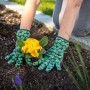 Gartenarbeit mit Baumwollhandschuhen (3er-Set, Gr. 8) beim Einpflanzen einer gelben Blume.
