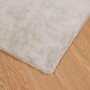 Beiger, rechteckiger vidaXL Kunstfell Teppich Hasen-Optik (240x240 cm) auf Holzboden.