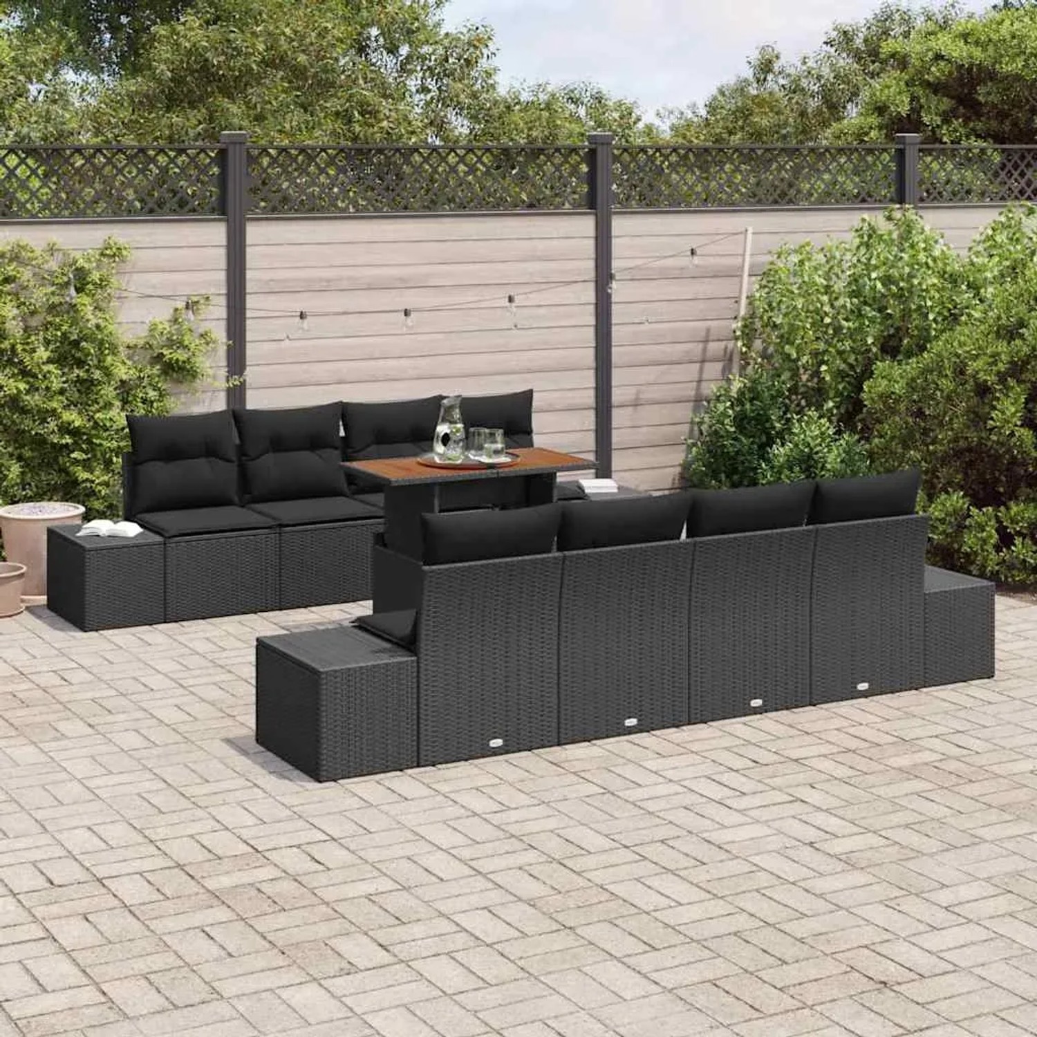 Schwarzes 9-teiliges vidaXL Garten-Sofa-Set aus Poly Rattan mit Tisch und Stauraum.