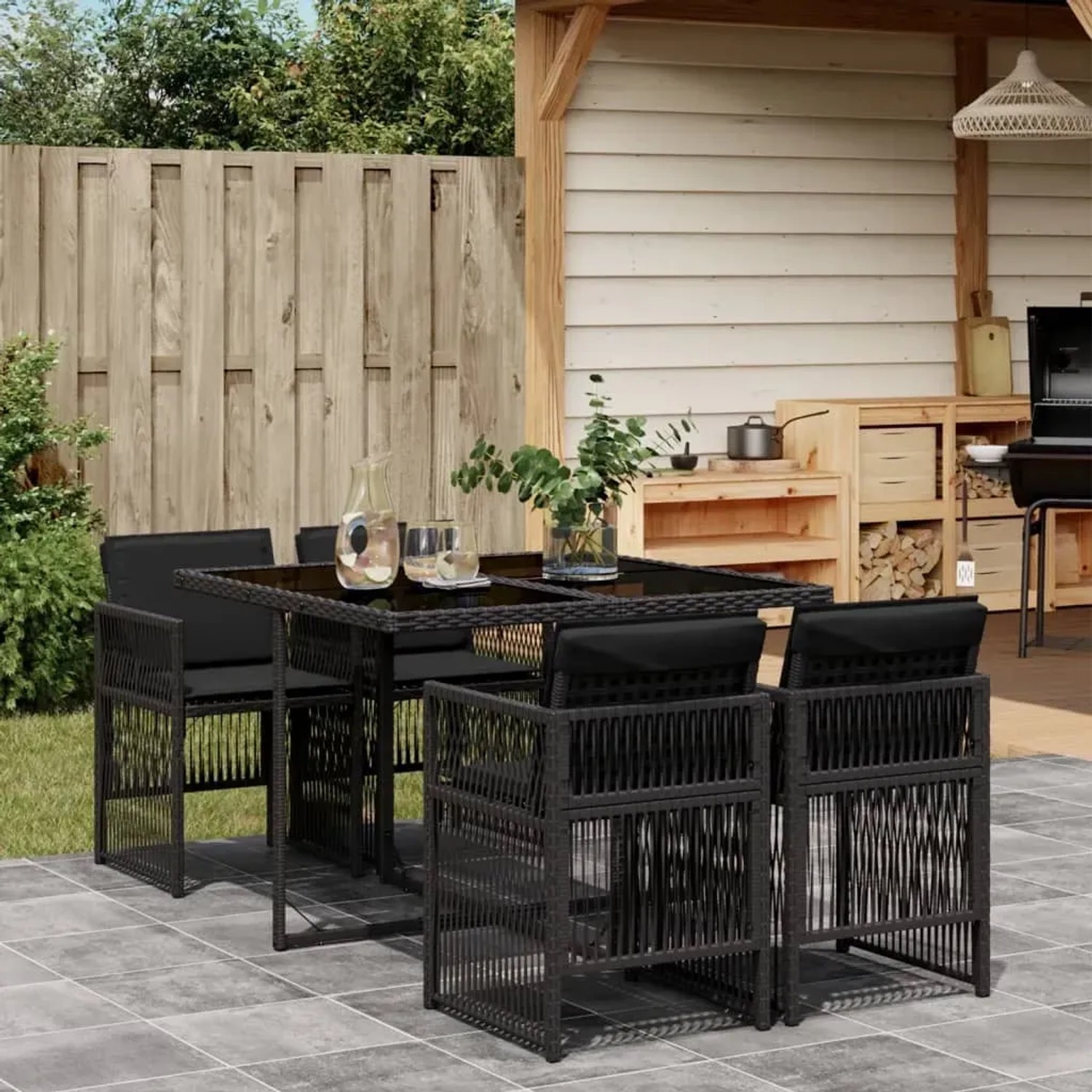 Schwarze 5-tlg. vidaXL Garten-Essgruppe aus Polyrattan mit Kissen für Terrasse und Garten.