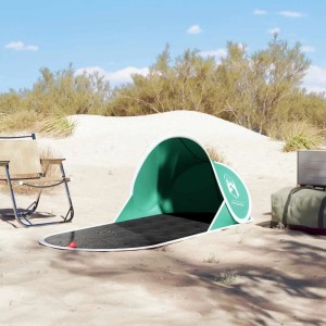 Meergrünes Furnicato Pop Up Strandzelt auf Sandstrand. Bietet Schatten und Schutz für Camping.
