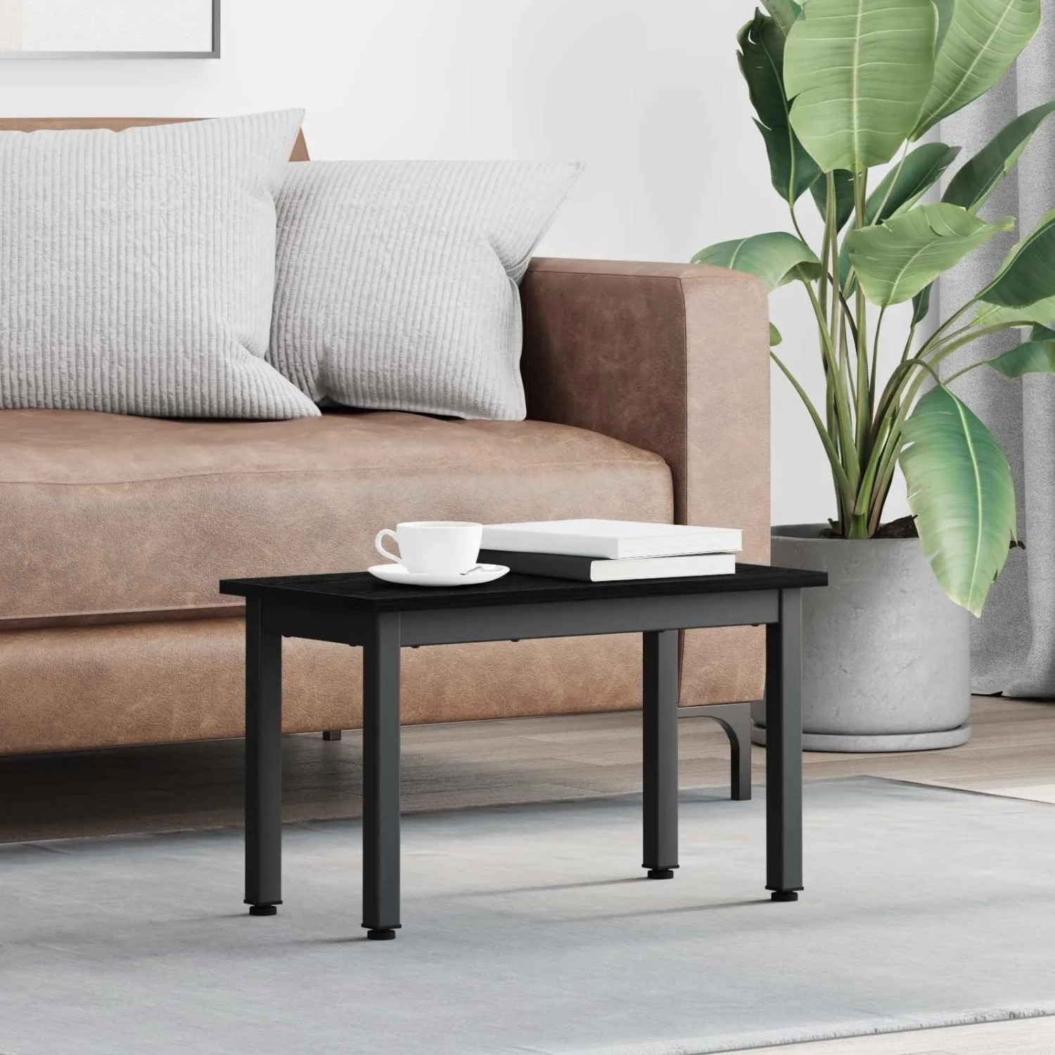 Schwarzer Couchtisch in Eichen-Optik (60x30x36 cm) aus Holzwerkstoff von vidaXL.