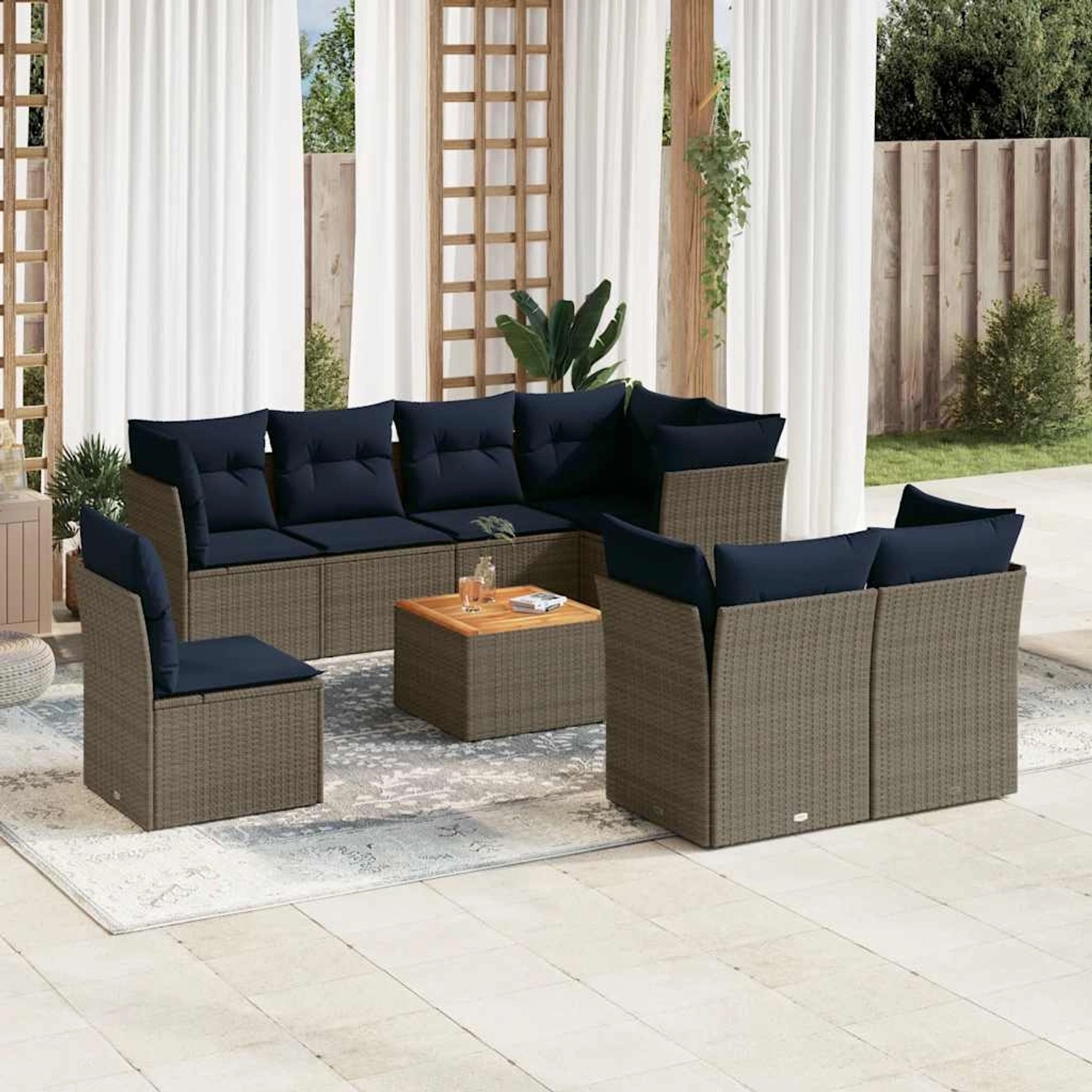 Graue 9-teilige vidaXL Garten-Sofagarnitur aus Polyrattan mit blauen Kissen und Tisch.