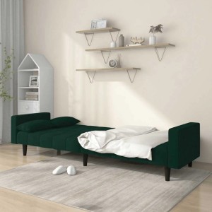 Dunkelgrünes Schlafsofa 2-Sitzer aus Samt mit Kissen, ausgeklappt als Bett.