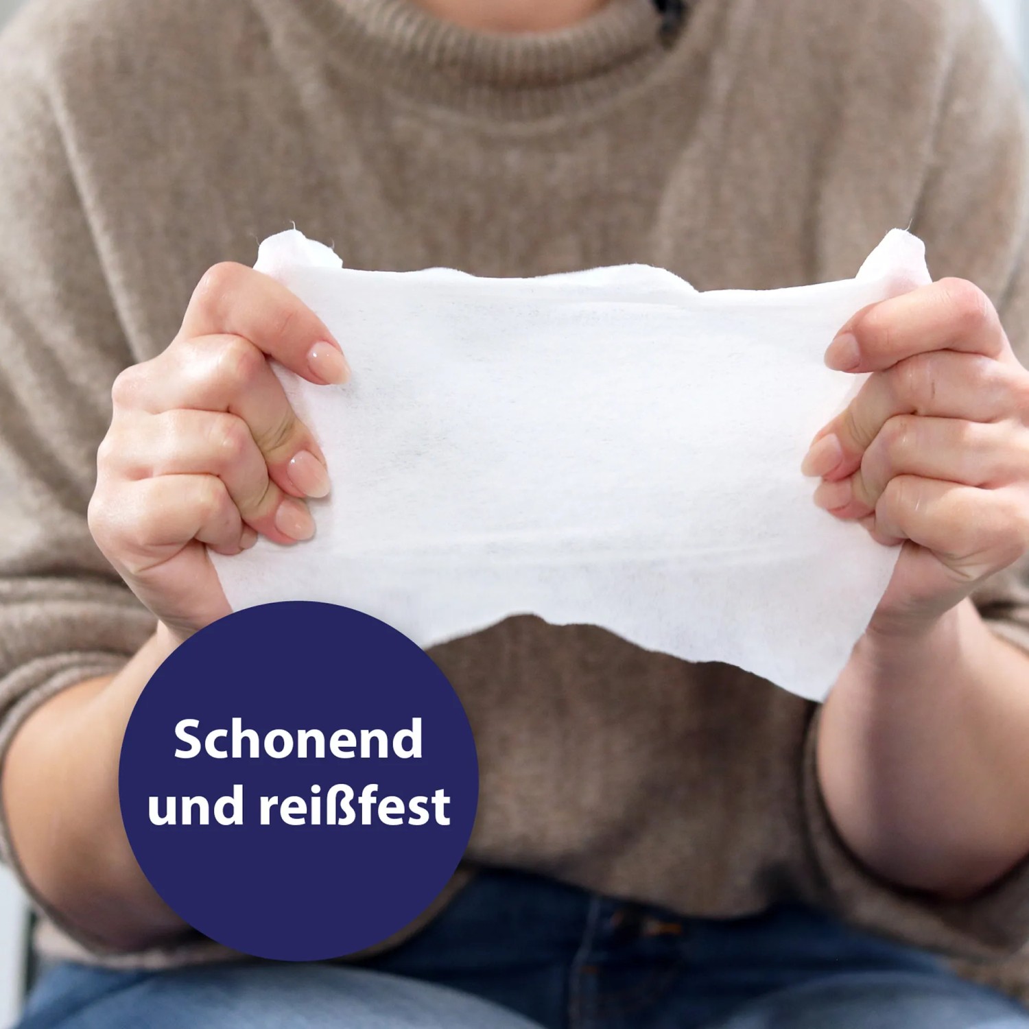 Canosept Pflegetuch wird gedehnt, um Reißfestigkeit zu zeigen. Ideal für Hunde.