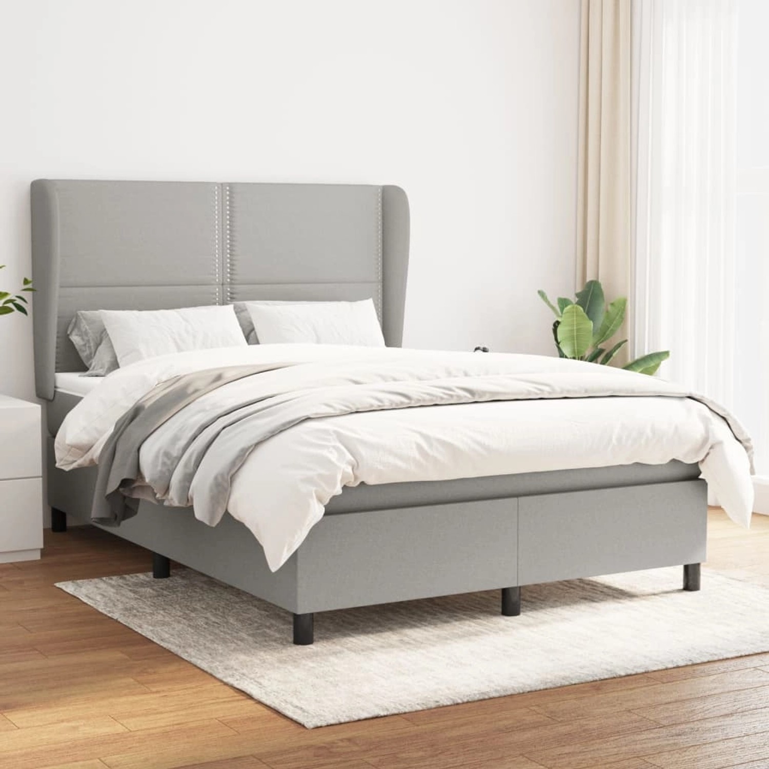 Helles vidaXL Boxspringbett mit Matratze (140x190 cm) und Stoffbezug im Schlafzimmer.