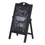 Schwarze klappbare Werbetafel aus Paulowniaholz mit Herz-Ornament und Kreidebeschriftung "Enjoy the little THINGS".