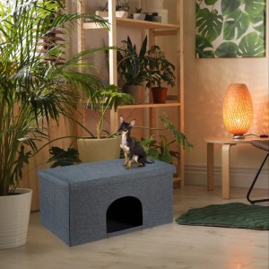 Graue Relaxdays Katzenhöhle mit Sitzauflage und kleinem Hund.