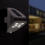 Moderne Lutec LED Solar-Wandleuchte Zeta mit Bewegungsmelder und Solarpanel.