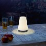 LED-Akku-Tischleuchte Sepino, schwarz-weiß, Ø 13cm, mit Tragehenkel für Innen- und Außenbereich.
