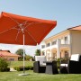 Schneider Balkonschirm Oslo, 300x200 cm, Terracotta, mit Kurbel, im Garten.