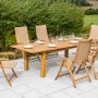 7-teiliges Gartenmöbel-Set Capri mit Doppelausziehtisch aus Akazienholz und Polyrattan.