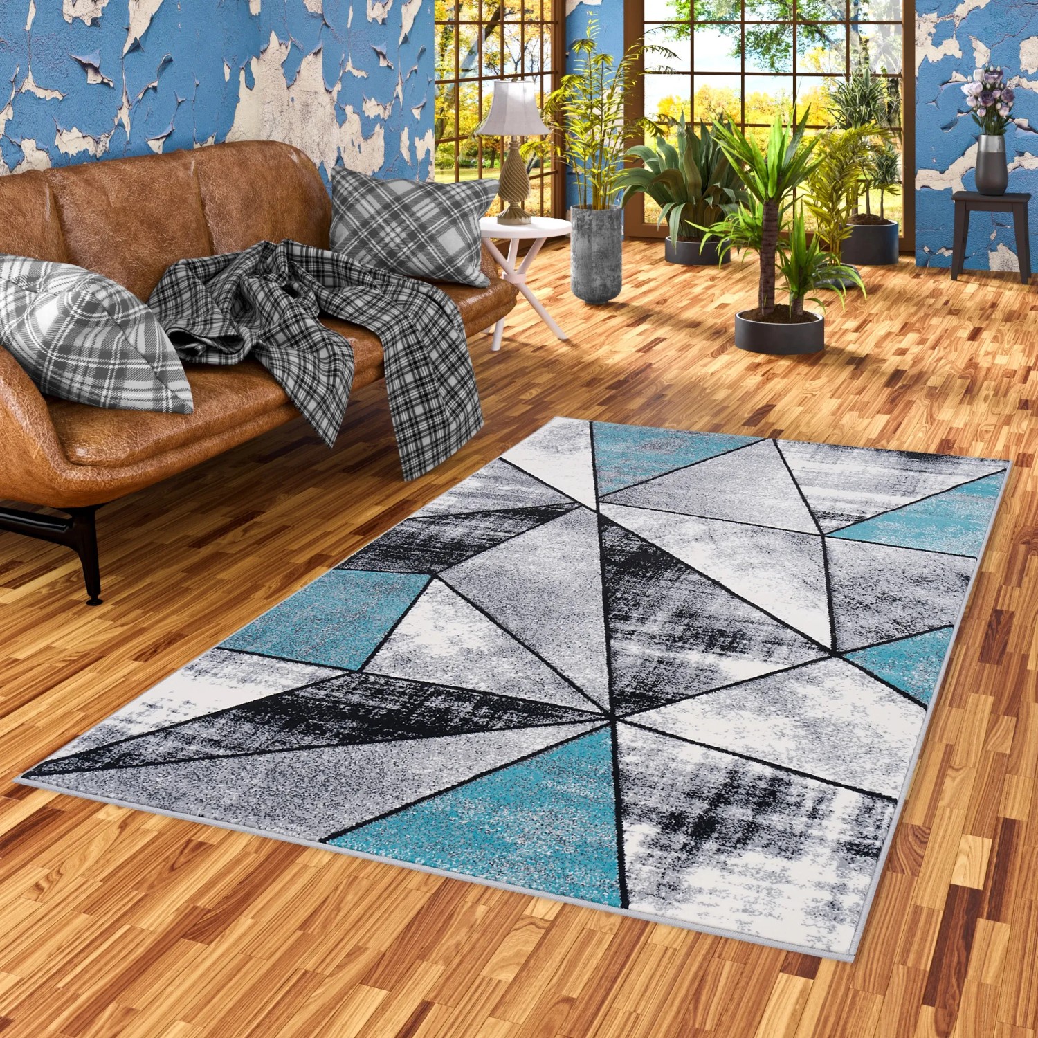 Blauer Designer Teppich Brilliant Magic 160x230cm mit modernem Dreiecksmuster.