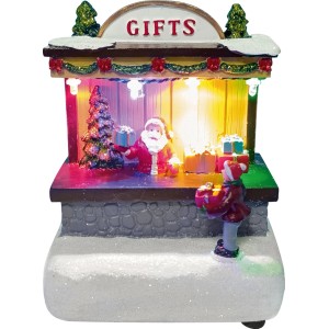 Beleuchtete Weihnachtsdorf Figur aus Polyresin: Santa Claus und Kind vor einem Geschenkeladen im Schnee. Festliche Weihnachtsdekoration.