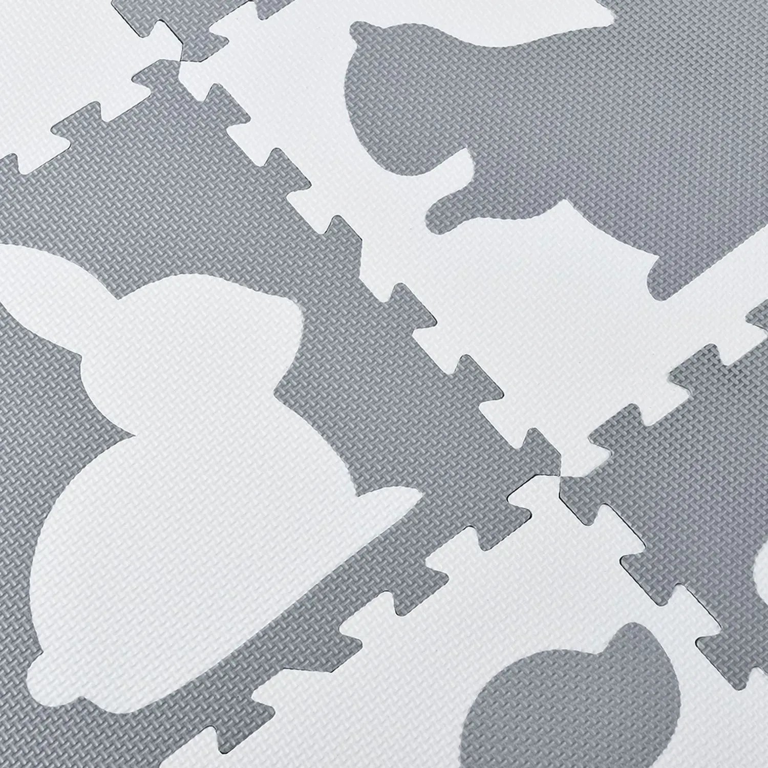 Juskys Kinder Puzzlematte Timon, 36-teilig, grau-weiß mit Tiermotiven, aus EVA-Schaumstoff.