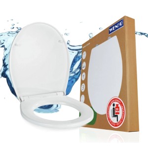Weißer WENKO WC-Sitz Ostuni mit Absenkautomatik, offen, neben Verpackung. Ovale Form, Thermoplast, 300 kg Belastbarkeit.