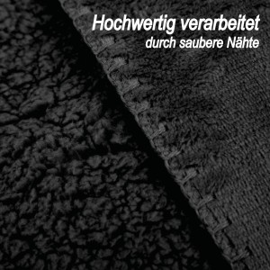 Detailaufnahme: Schwarze Bestlivings Kuscheldecke mit Teddy Fleece und sauberer Naht.