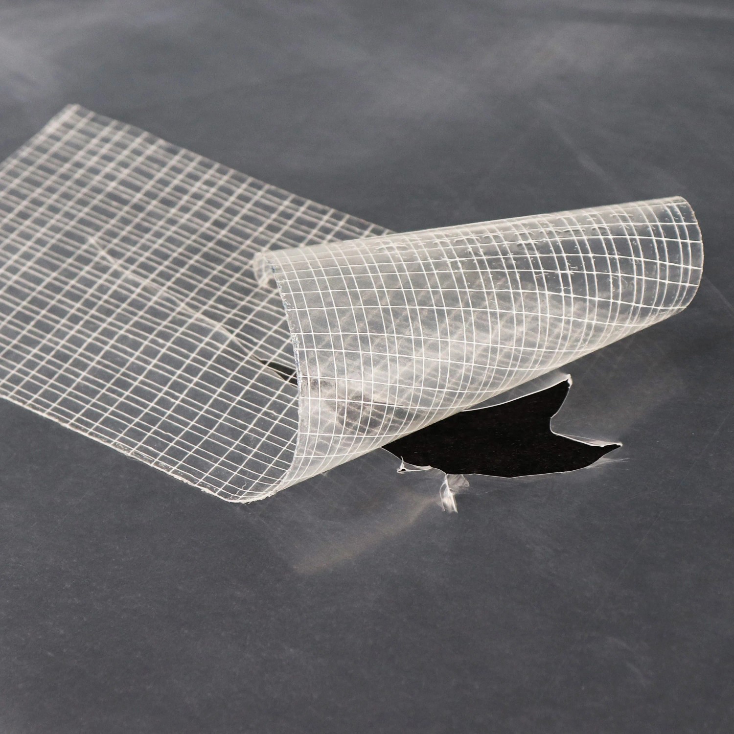 Aquagart Reparaturklebeband für Gewächshausfolie, transparent, mit Gitterstruktur.