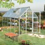 Palram Canopia Hybrid Gewächshaus (3.1x1.9m) in Silber mit klaren Seitenwänden und Pflanzen.