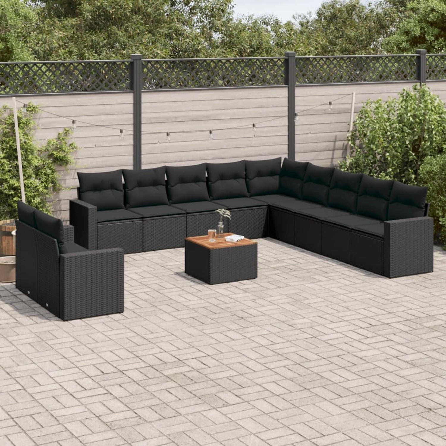 Schwarze 12-tlg. vidaXL Garten-Sofagarnitur aus Poly Rattan mit Kissen.