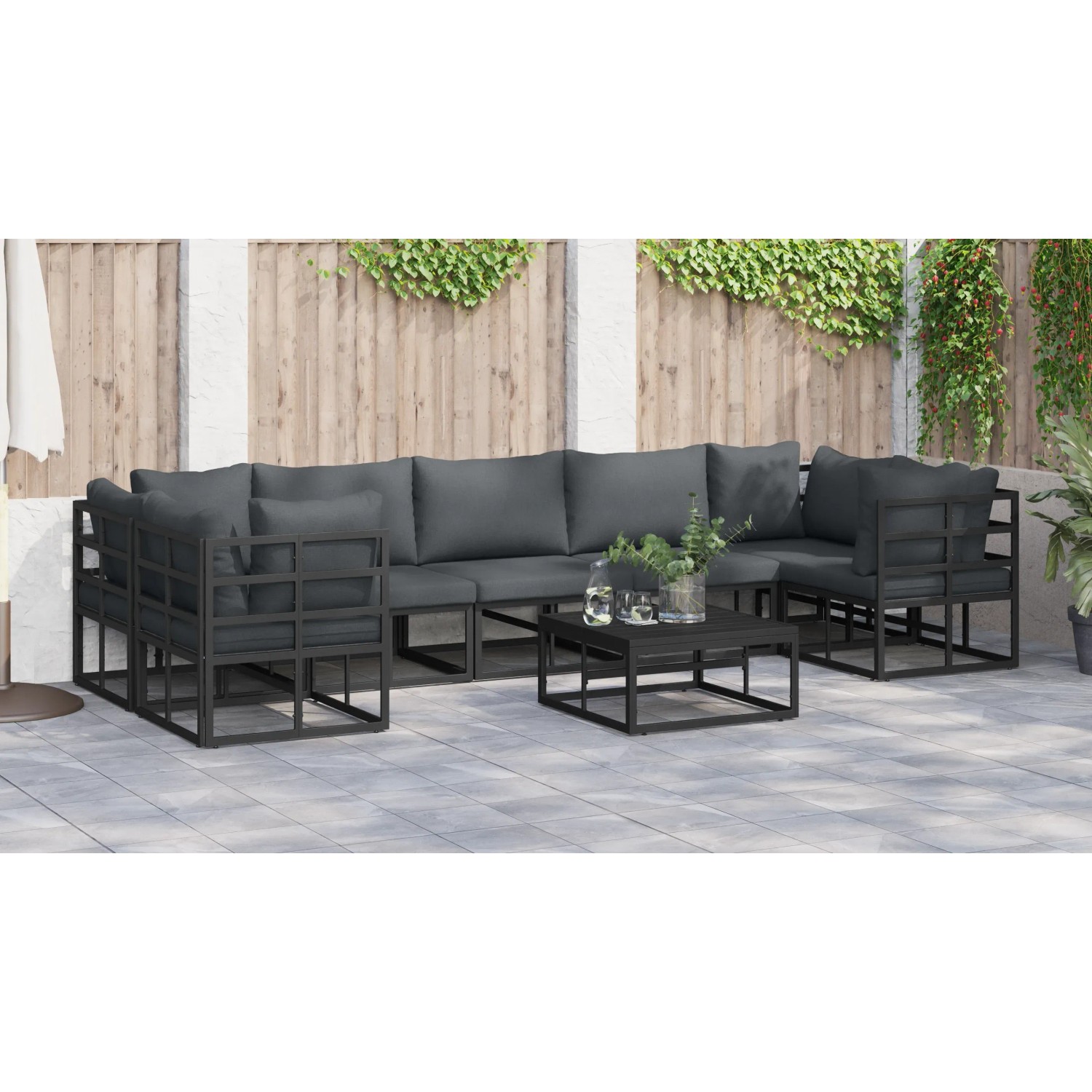 Schwarzes 7-teiliges vidaXL Garten-Sofa-Set aus Aluminium mit Tisch und grauen Kissen.