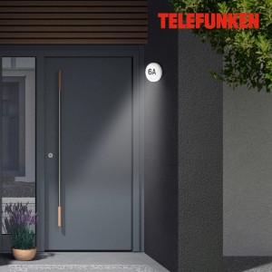 Telefunken Hausnummern-Set Numbers Schwarz an Hauswand mit Außenwandleuchte.
