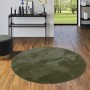 Runder, tannengrüner Fellteppich „Pergamon Luxus Super Soft“ mit weichem Flor.